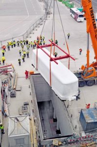 Munich Airport_new satellite terminal_13 March 2015 The undergorund Passenger Transport System is lifted into place